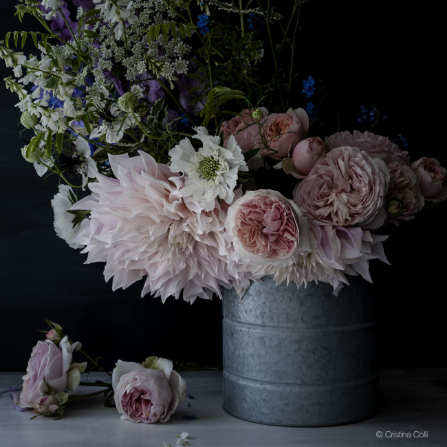 moody summer flowers in a bucket