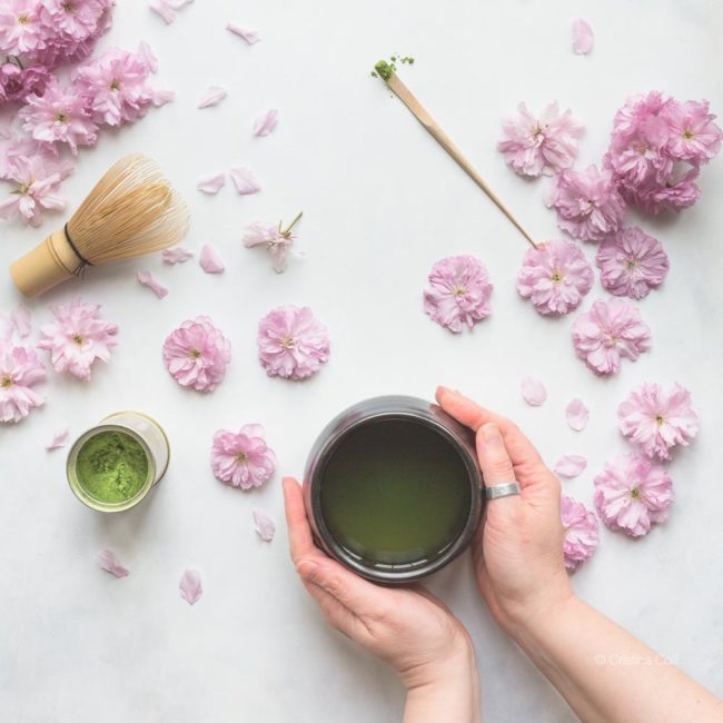 matcha tea spring blossom hands 